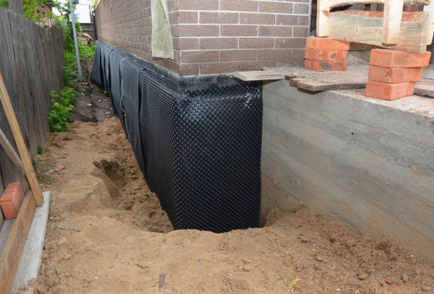 Happy homeowners after waterproofing job in Galveston